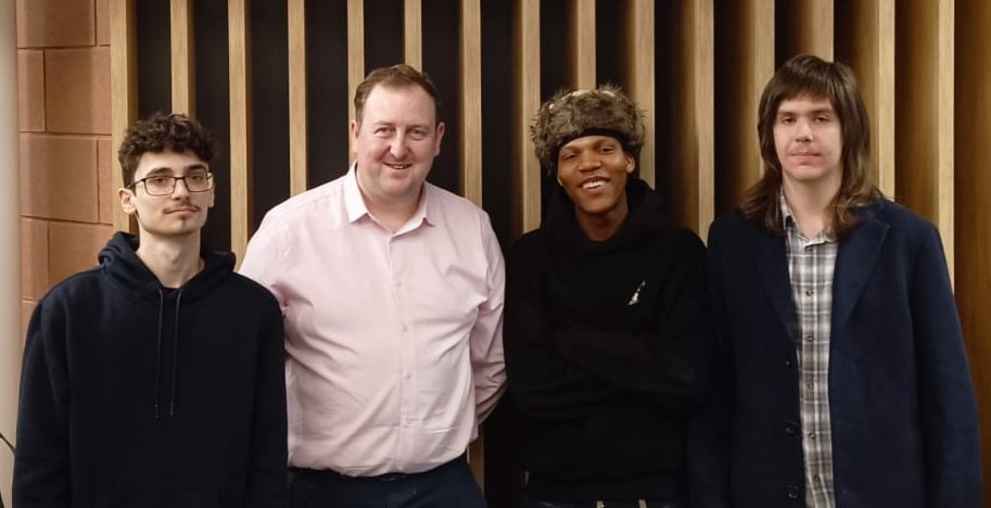A group photo of four people